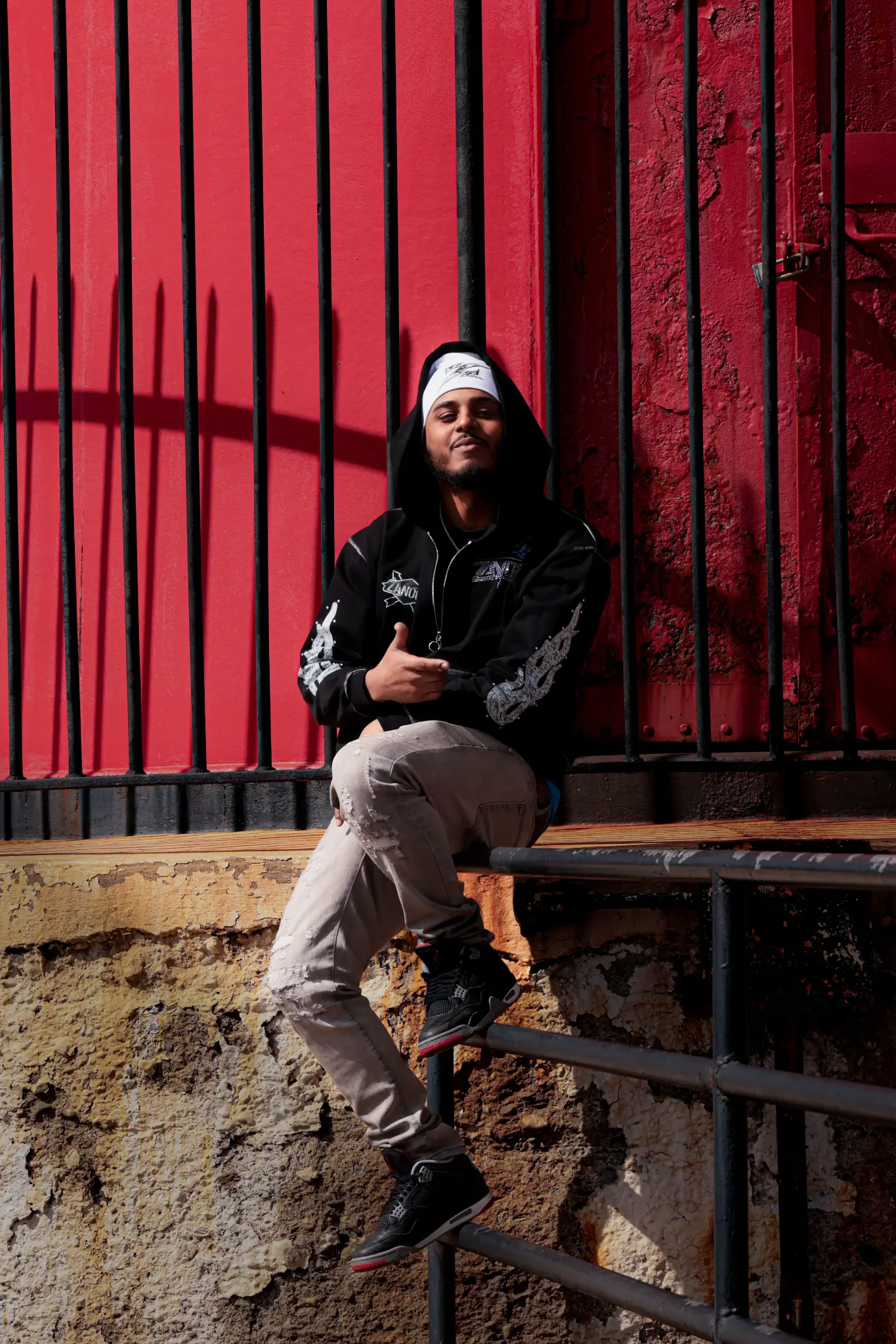 ABZ against the red wall